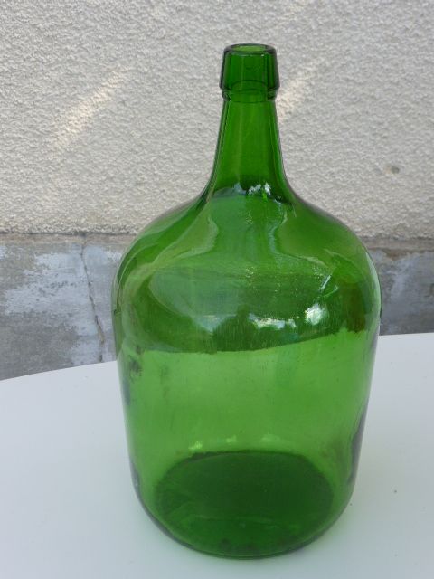 Dark green glass demijohn, vintage