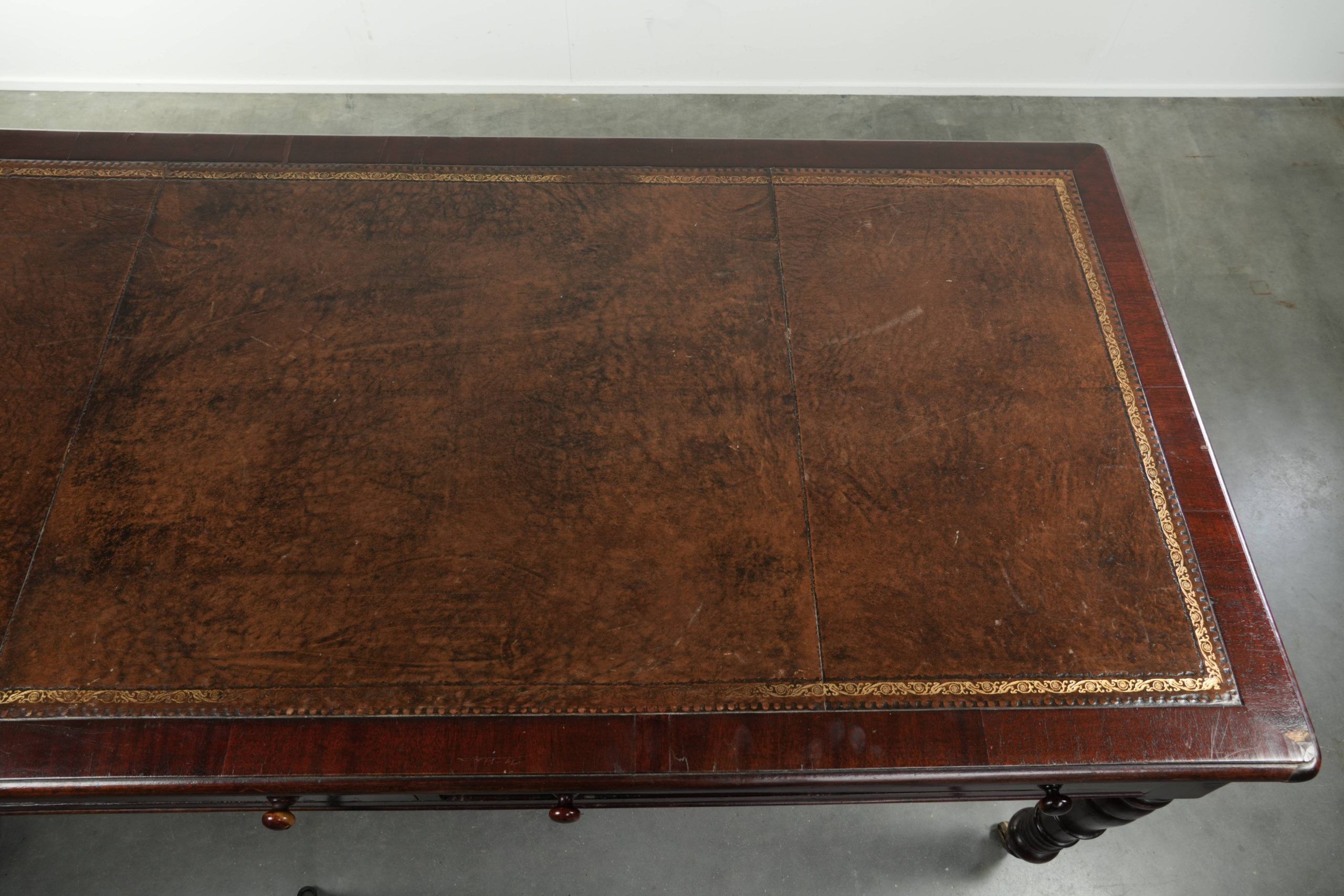 Antique English writing desk from the late 19th century with a warm colour