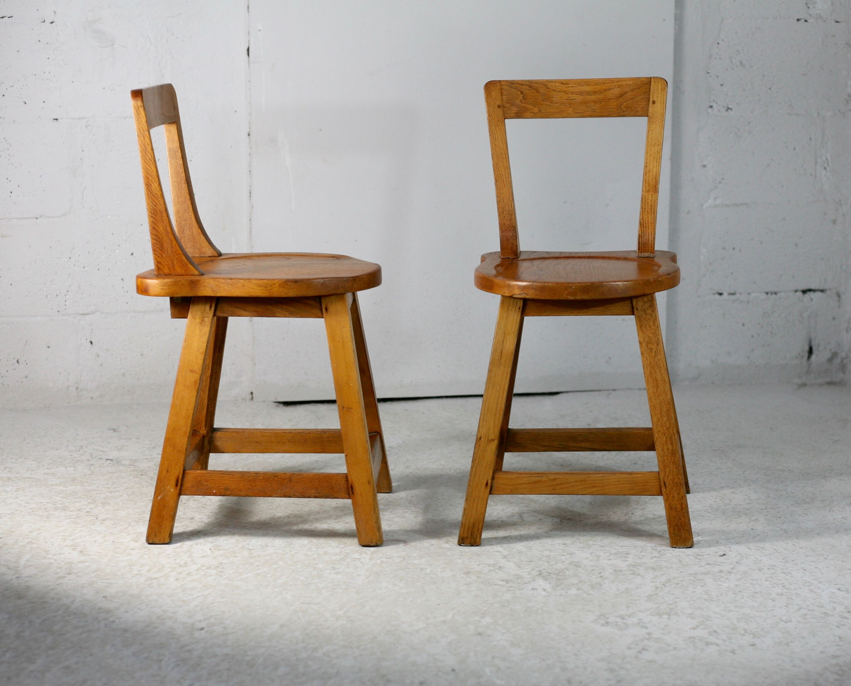 Pair of brutalist wooden back stools. France, circa 1960