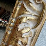 Vintage mirror cut out in a gilded wooden frame