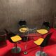 Set of black and yellow tulip chairs