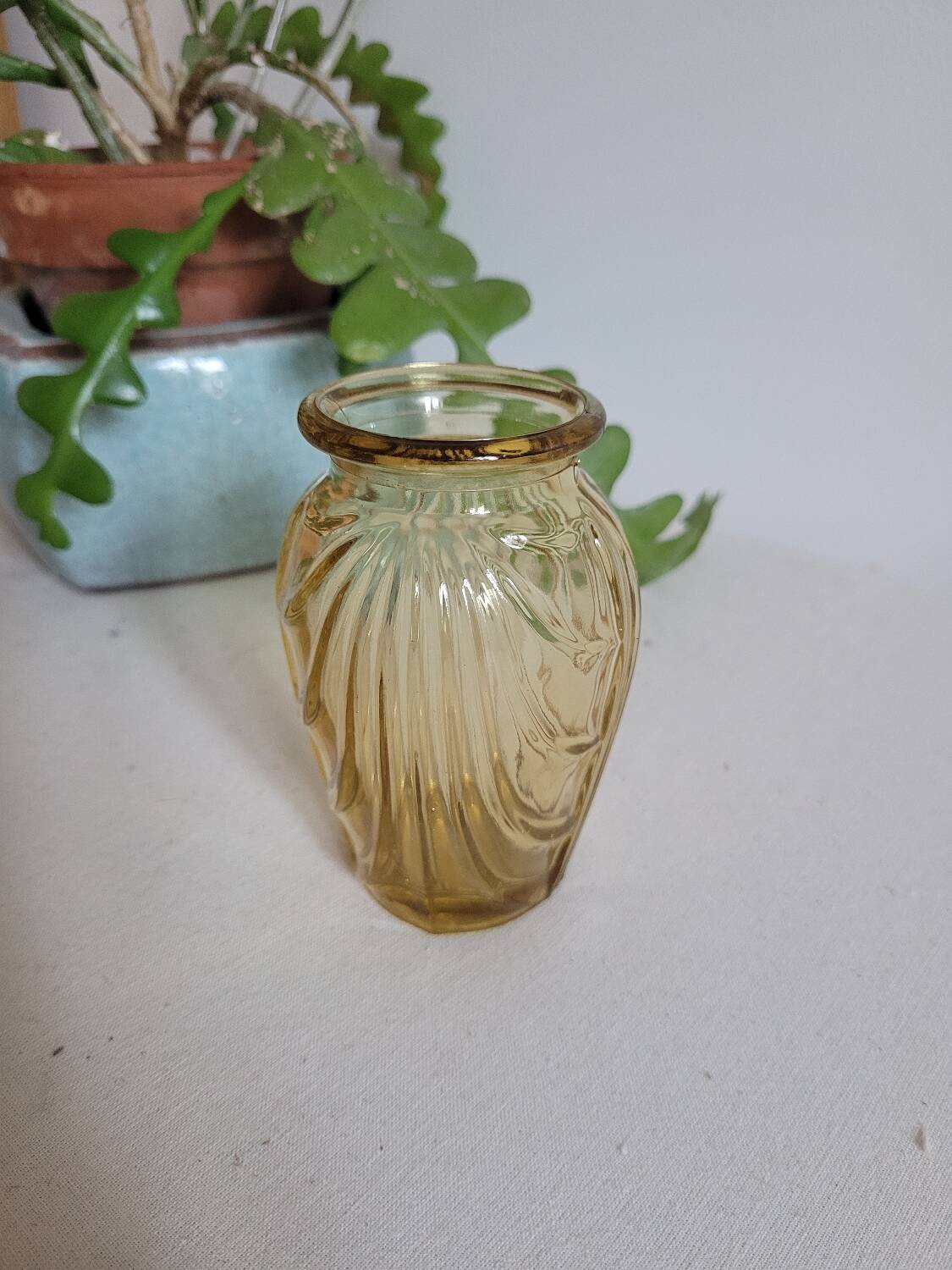 Small yellow draped bulb vase