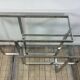 Chrome metal and glass console from the 2000s.