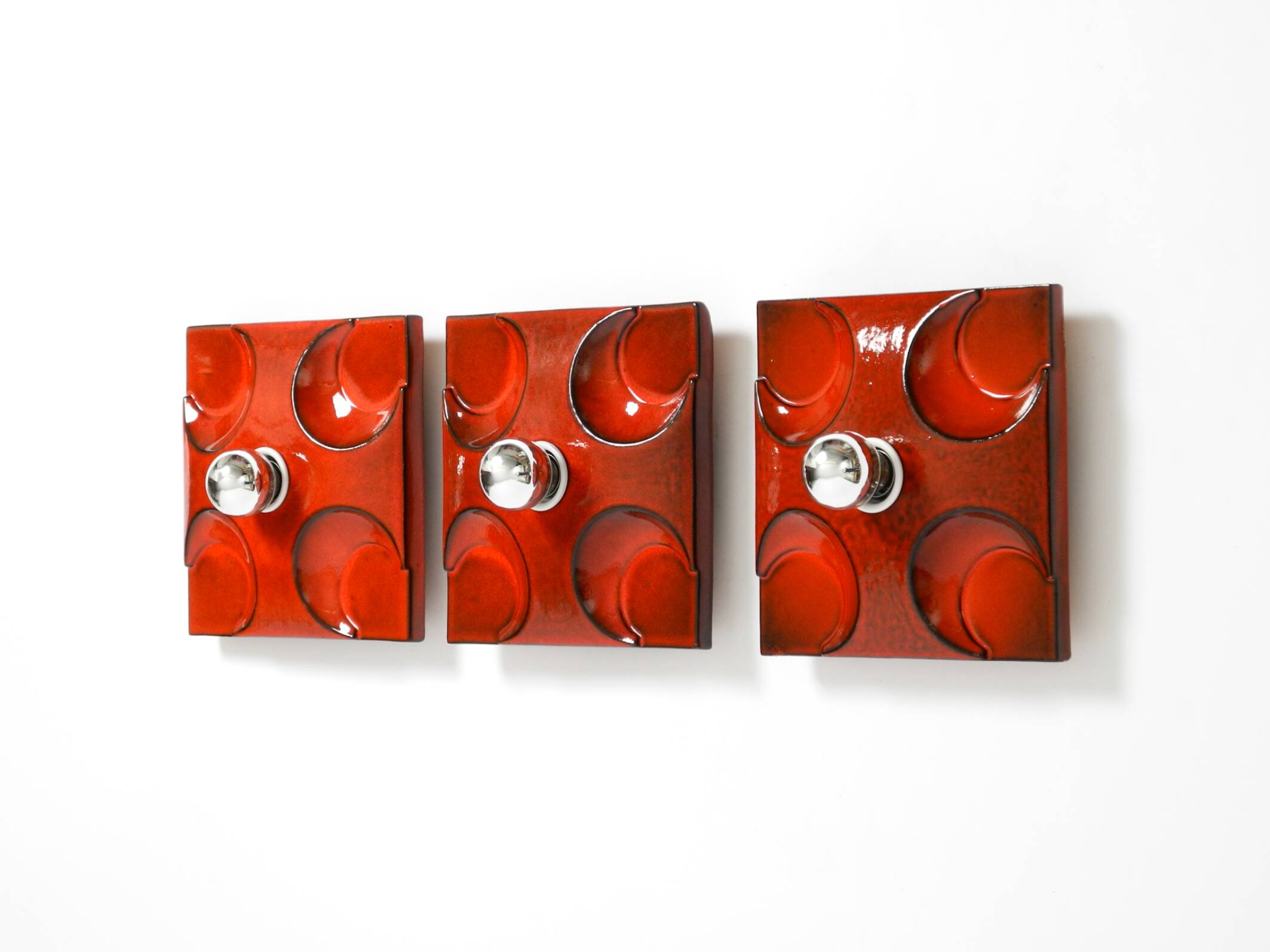 Three beautiful original 1970s Space Age red ceramic wall lamps