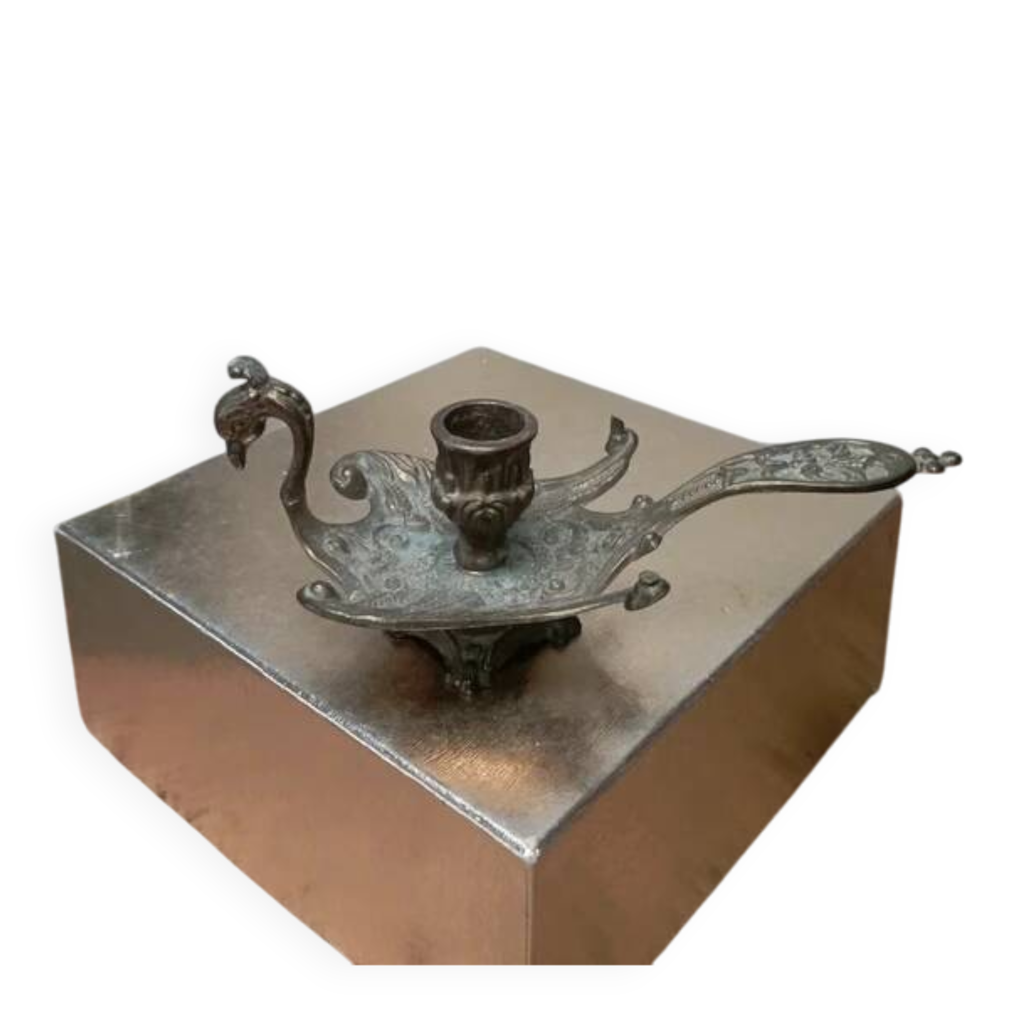 Chiselled brass candlestick in the shape of a peacock.