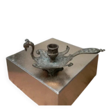 Chiselled brass candlestick in the shape of a peacock.