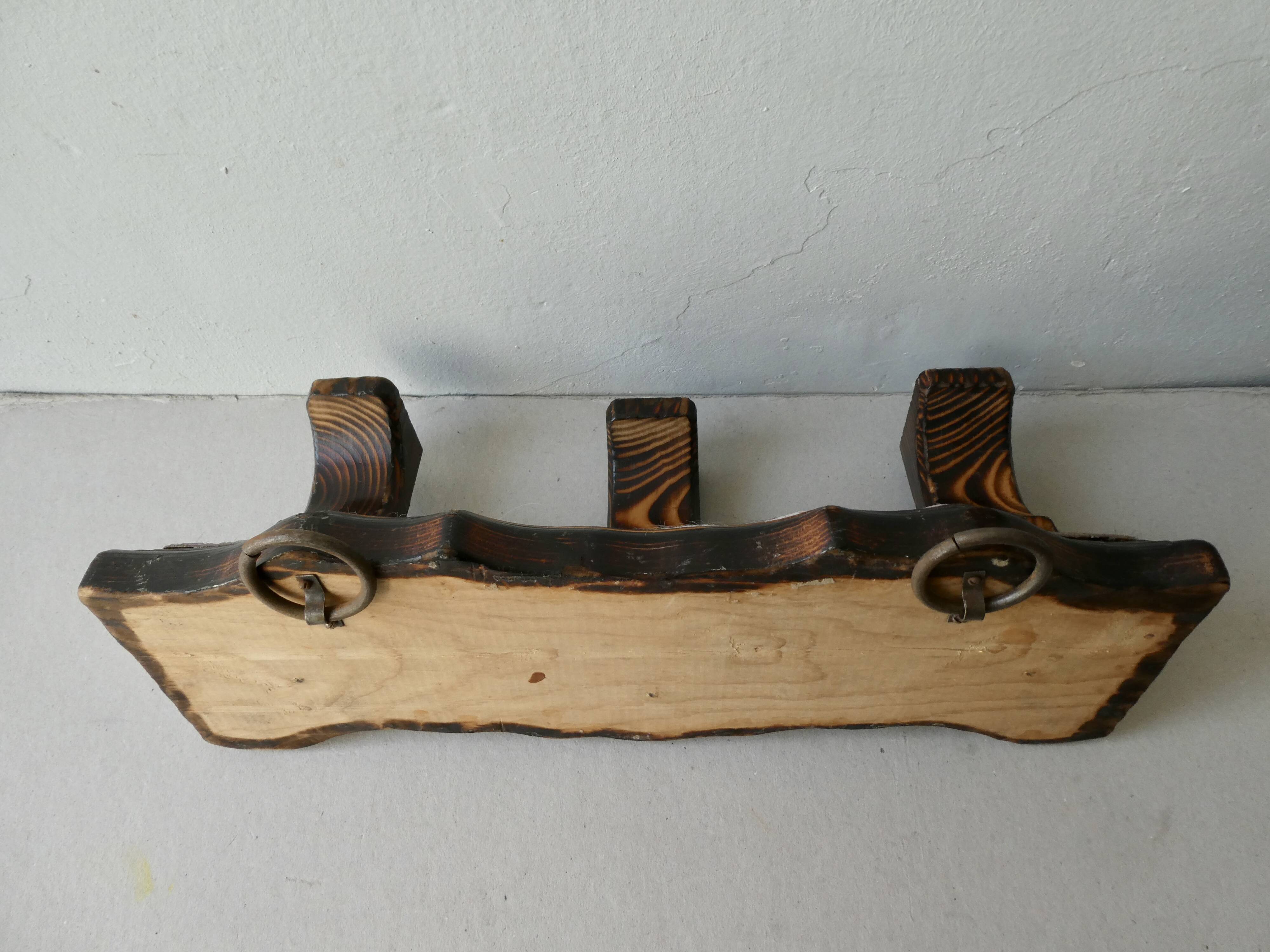 Wall hanger in burnt pine and cow skin