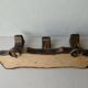 Wall hanger in burnt pine and cow skin