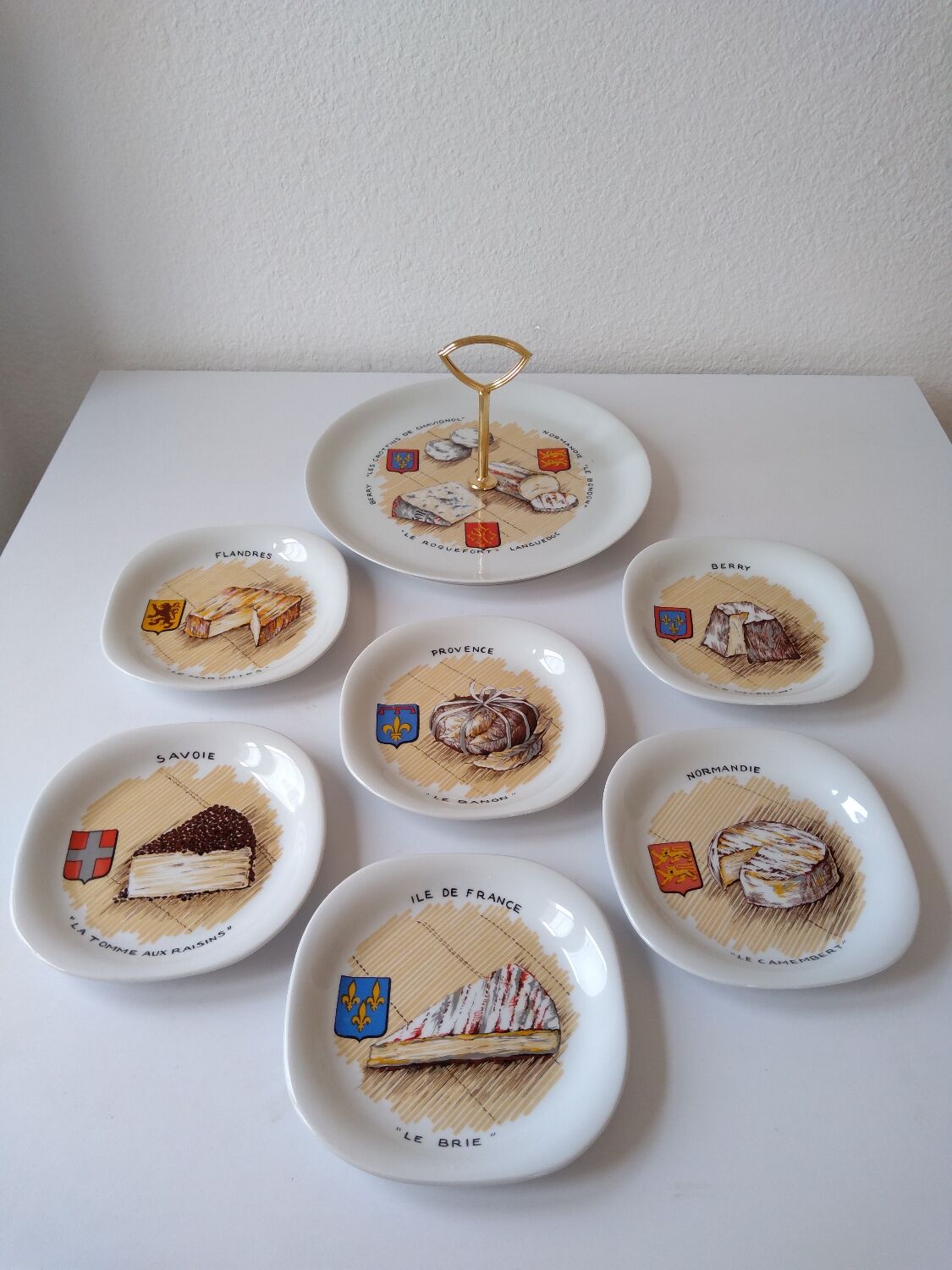 Limoges porcelain cheese service with drawing of regional cheeses and coats of arms 1 tray and 6 plates