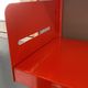 Modular red metal wall shelf in Congresso Lips Vago style.