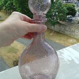A bolted glass carafe