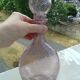 A bolted glass carafe