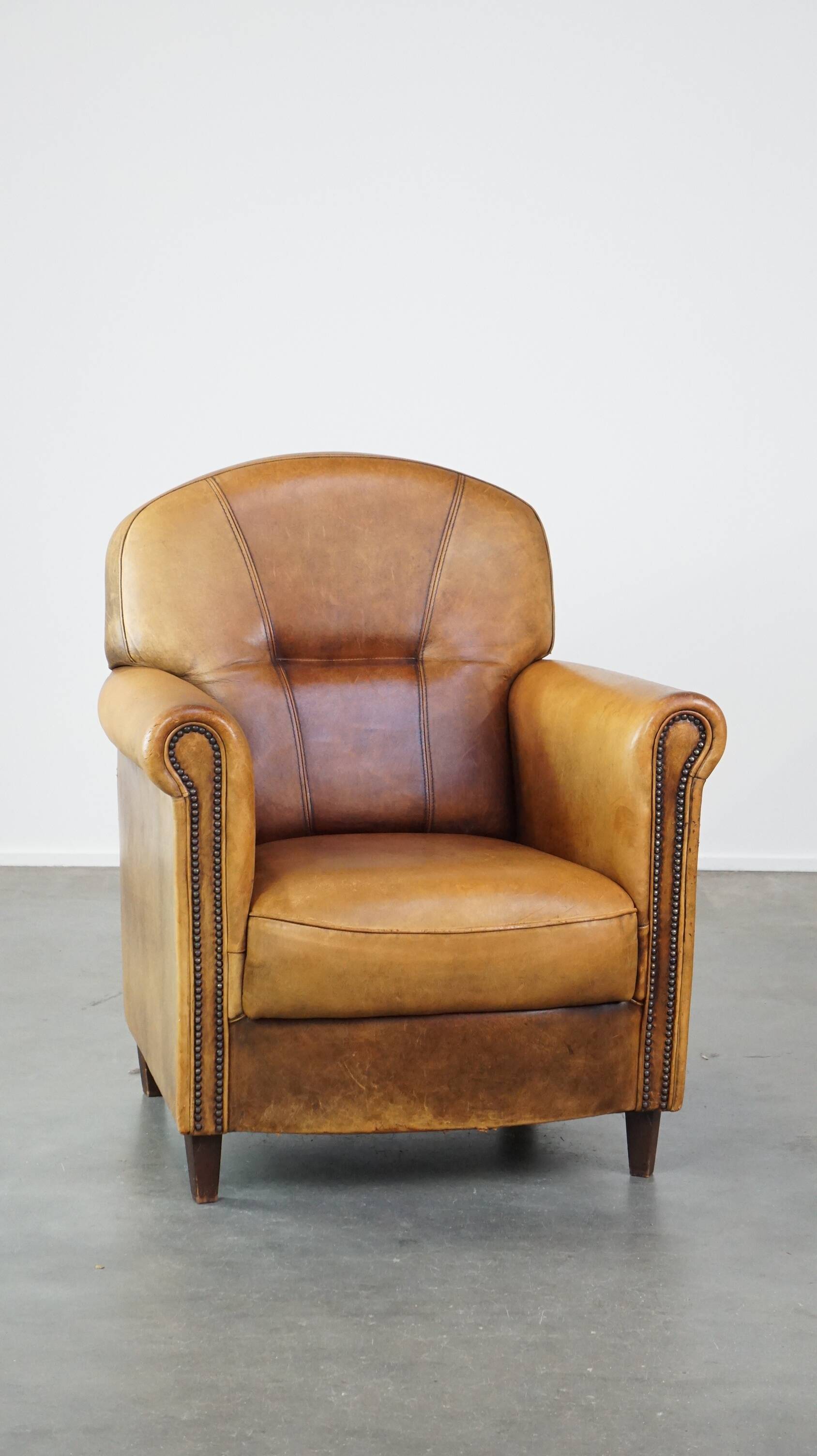 Stately, sleekly finished, comfortable sheepskin armchair