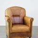 Stately, sleekly finished, comfortable sheepskin armchair