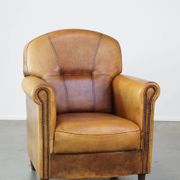 Stately, sleekly finished, comfortable sheepskin armchair