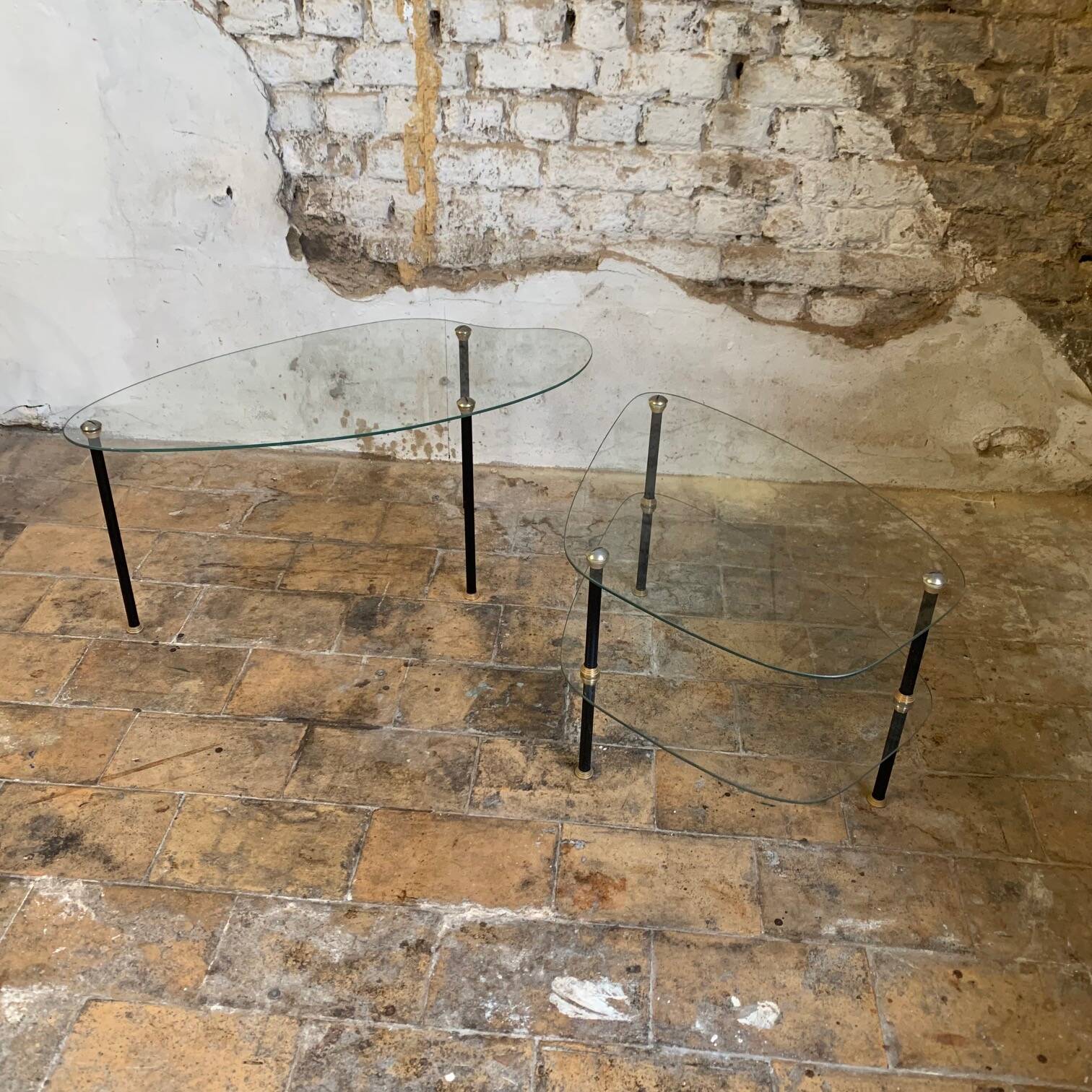 Pair of two 1950s glass and metal coffee tables, in the style of Edoardo Paoli