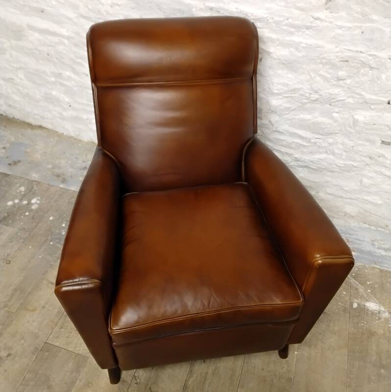 Antique club armchair from the 1950s with compass feet