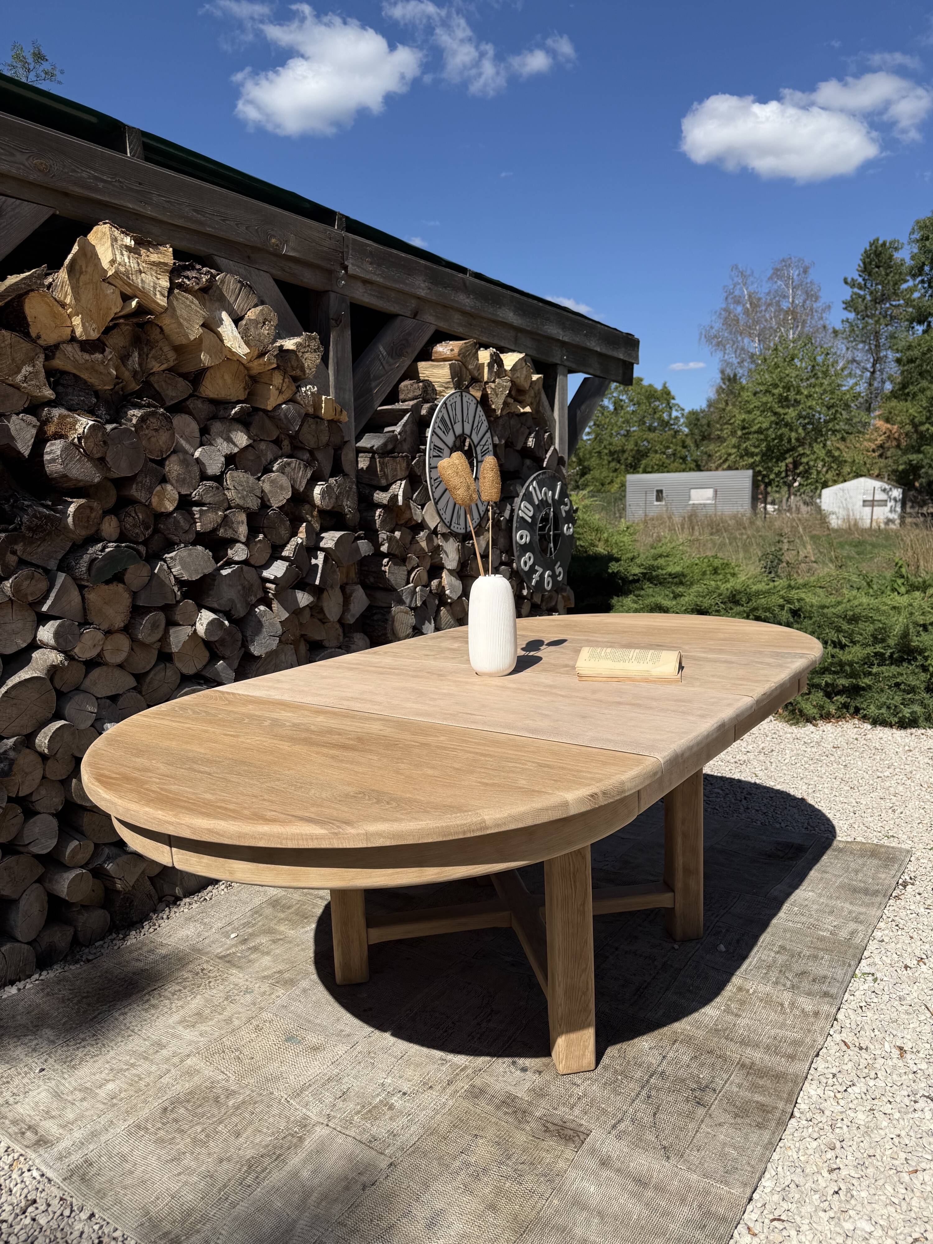 Round solid oak table with extensions, maximum 220cm.
