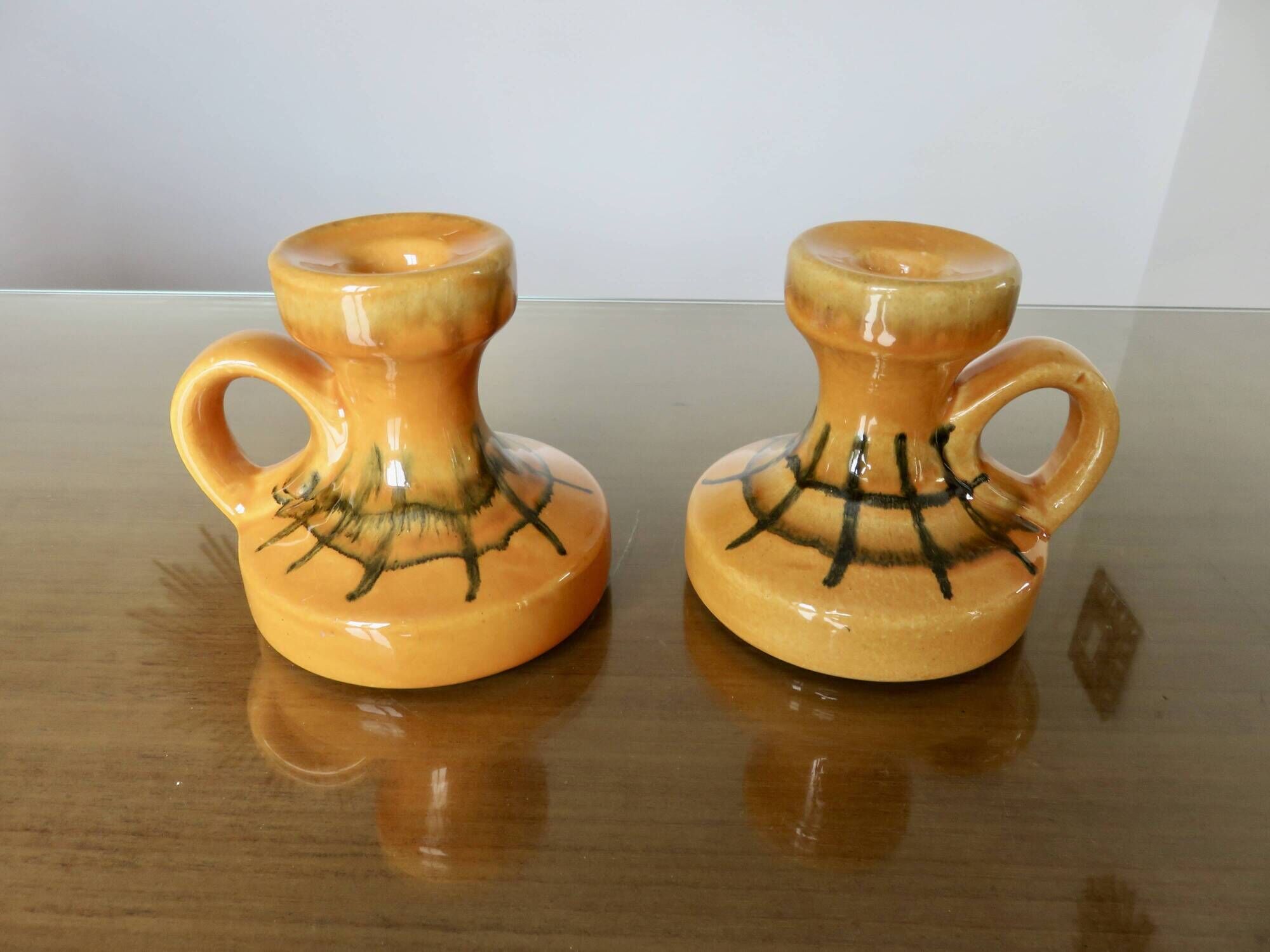 Pair of orange ceramic candlesticks from the 60s
