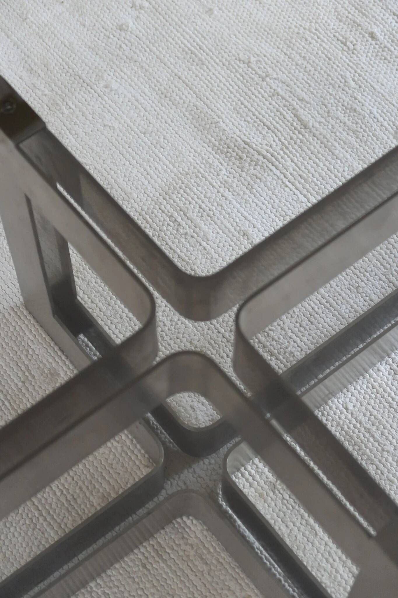 Smoked glass coffee table, brushed stainless steel base, 1970s.
