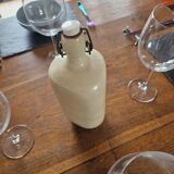 Old bottle of beige sandstone hot water bottle