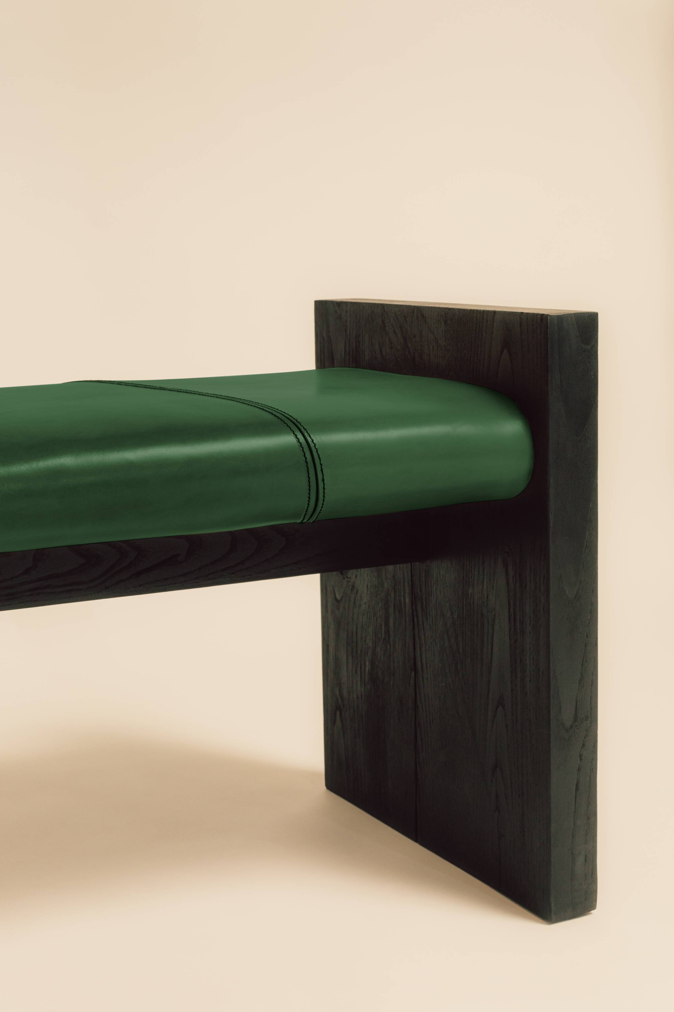 Maërl bench, sepia model, ebonized chestnut and green leather