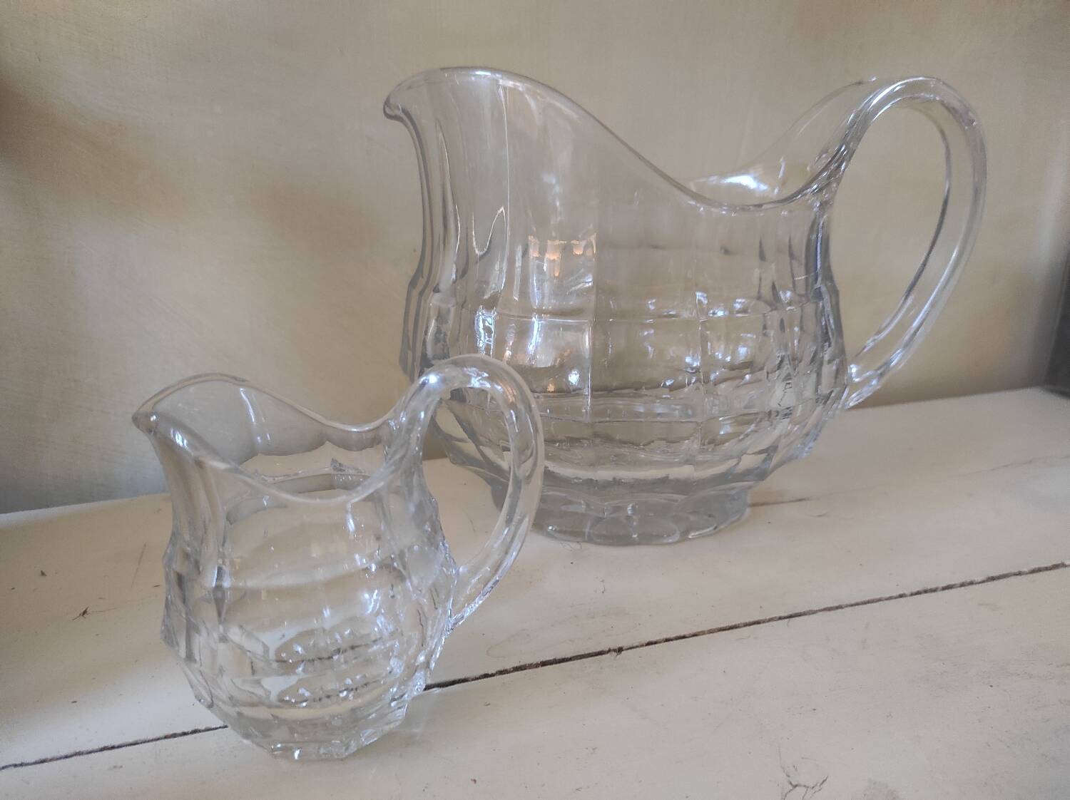 2 antique glass pitchers