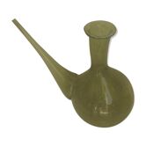 Green transparent glass bottle. Long-beaked biot.