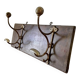 Patinated wood and metal coat rack from the 1950s.