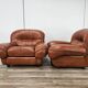 2 fauteuils en cuir cognac, années 1970