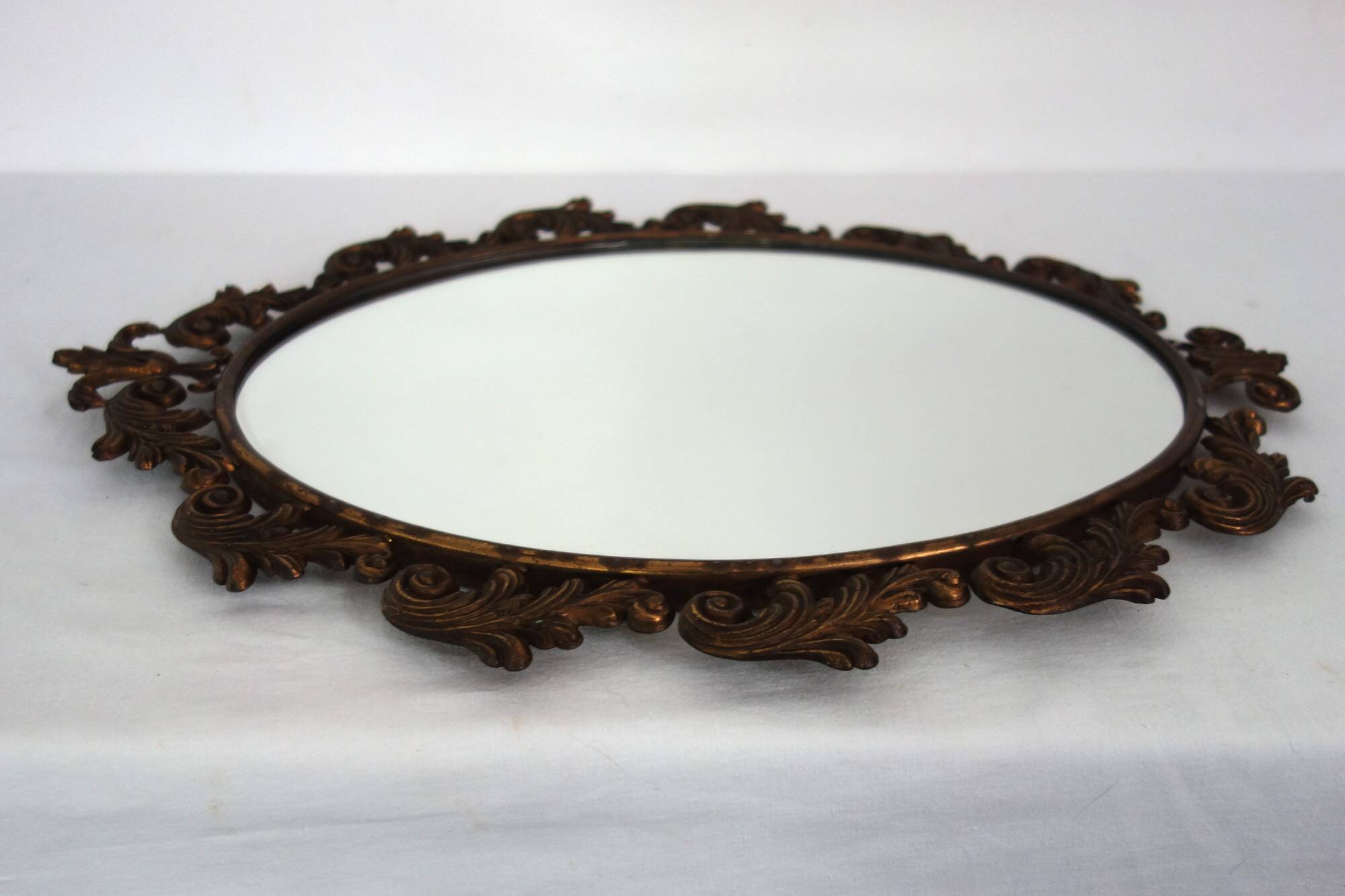 Antique oval art deco brass mirror