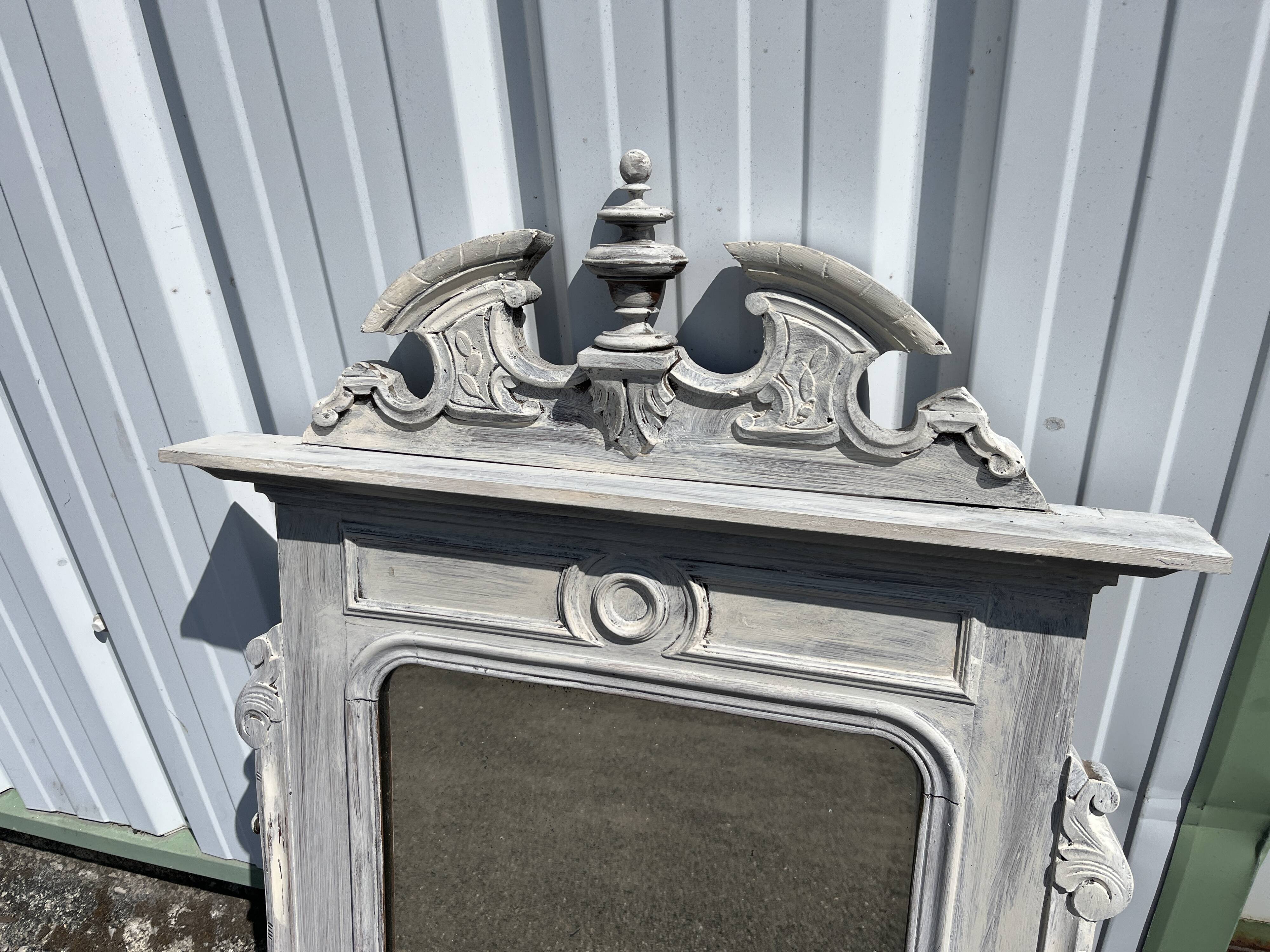 Large decorative mirror in carved wood with shabby patina