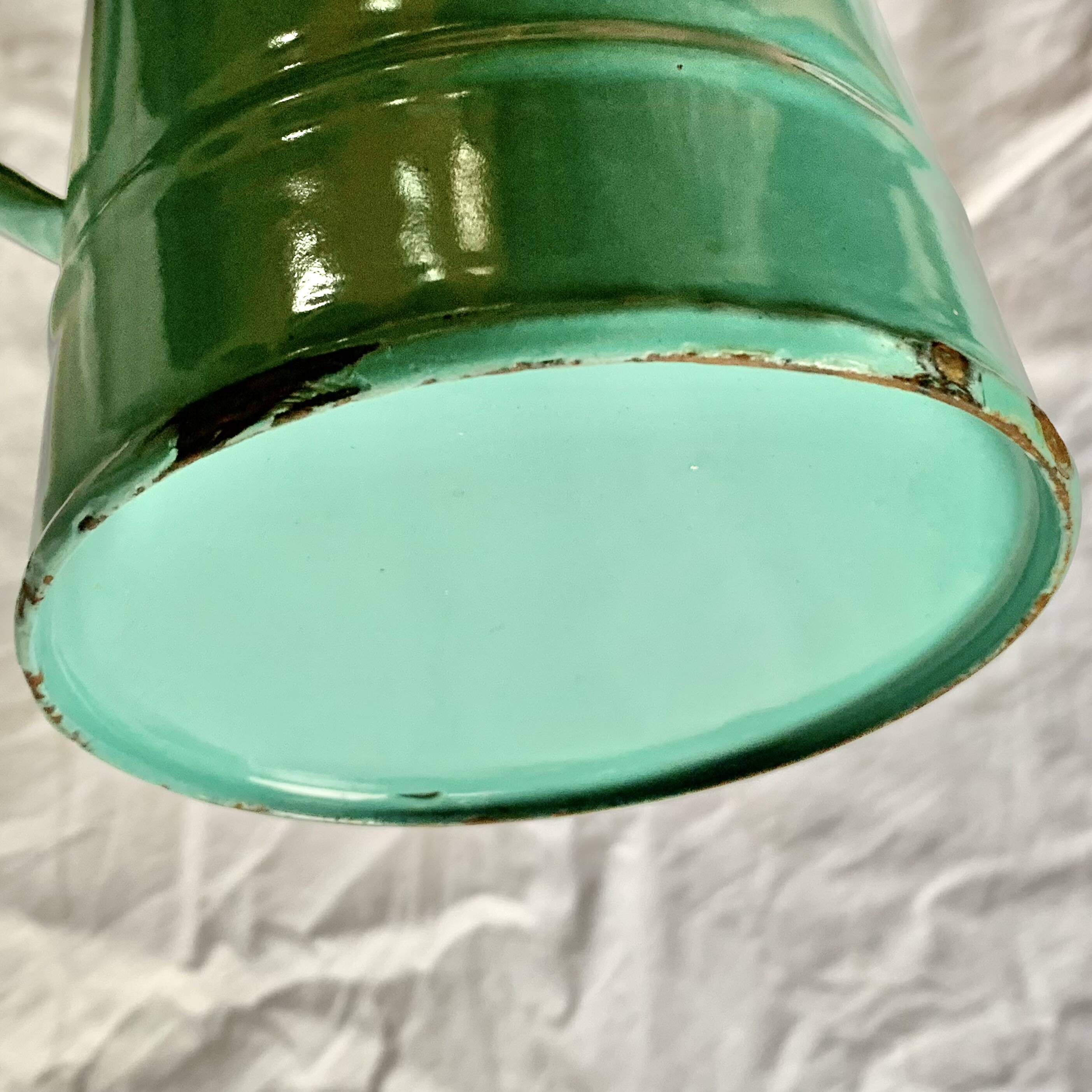 Vintage pitcher in green enameled sheet metal