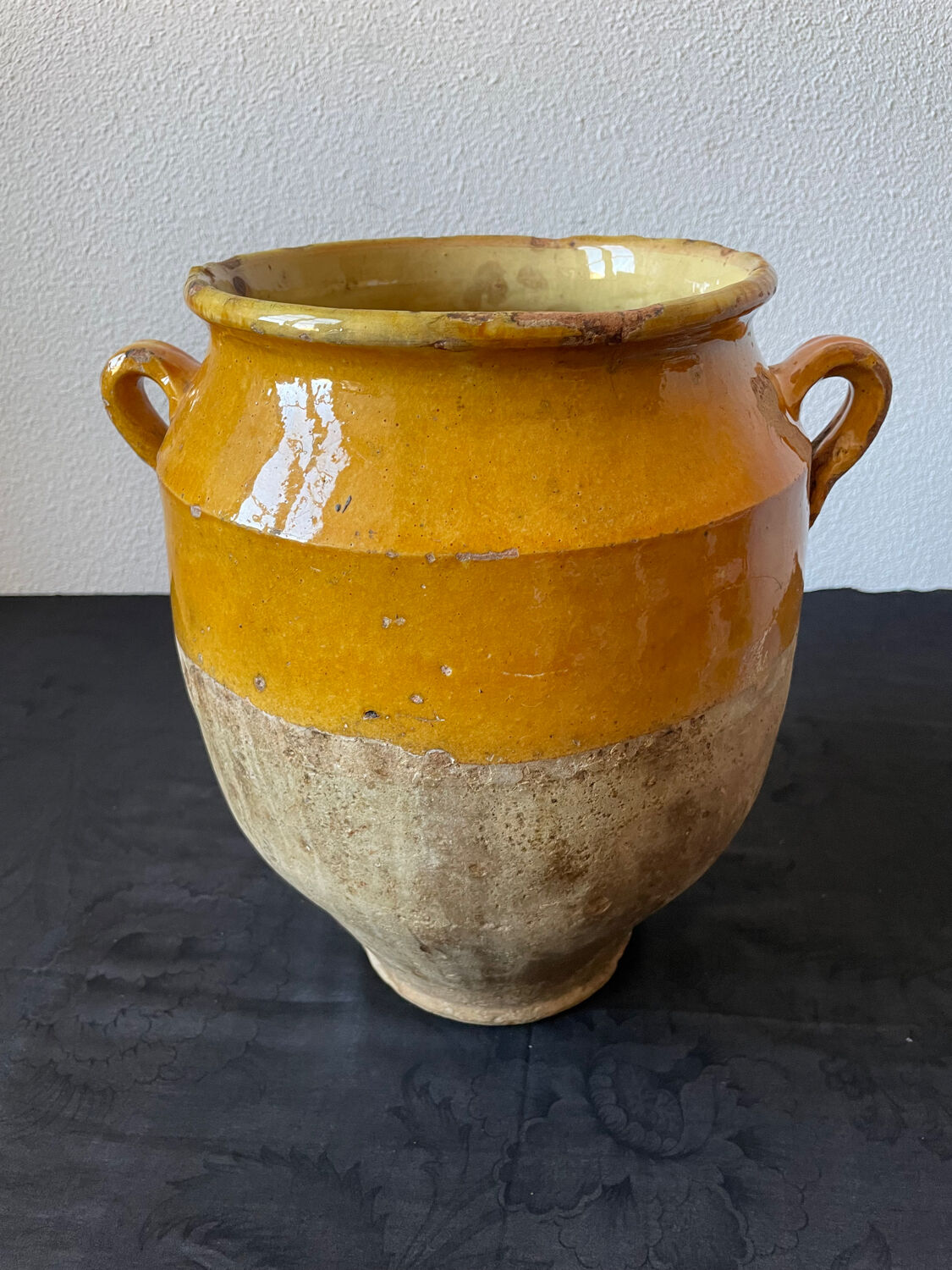 Old yellow glazed terracotta grease pot south west France