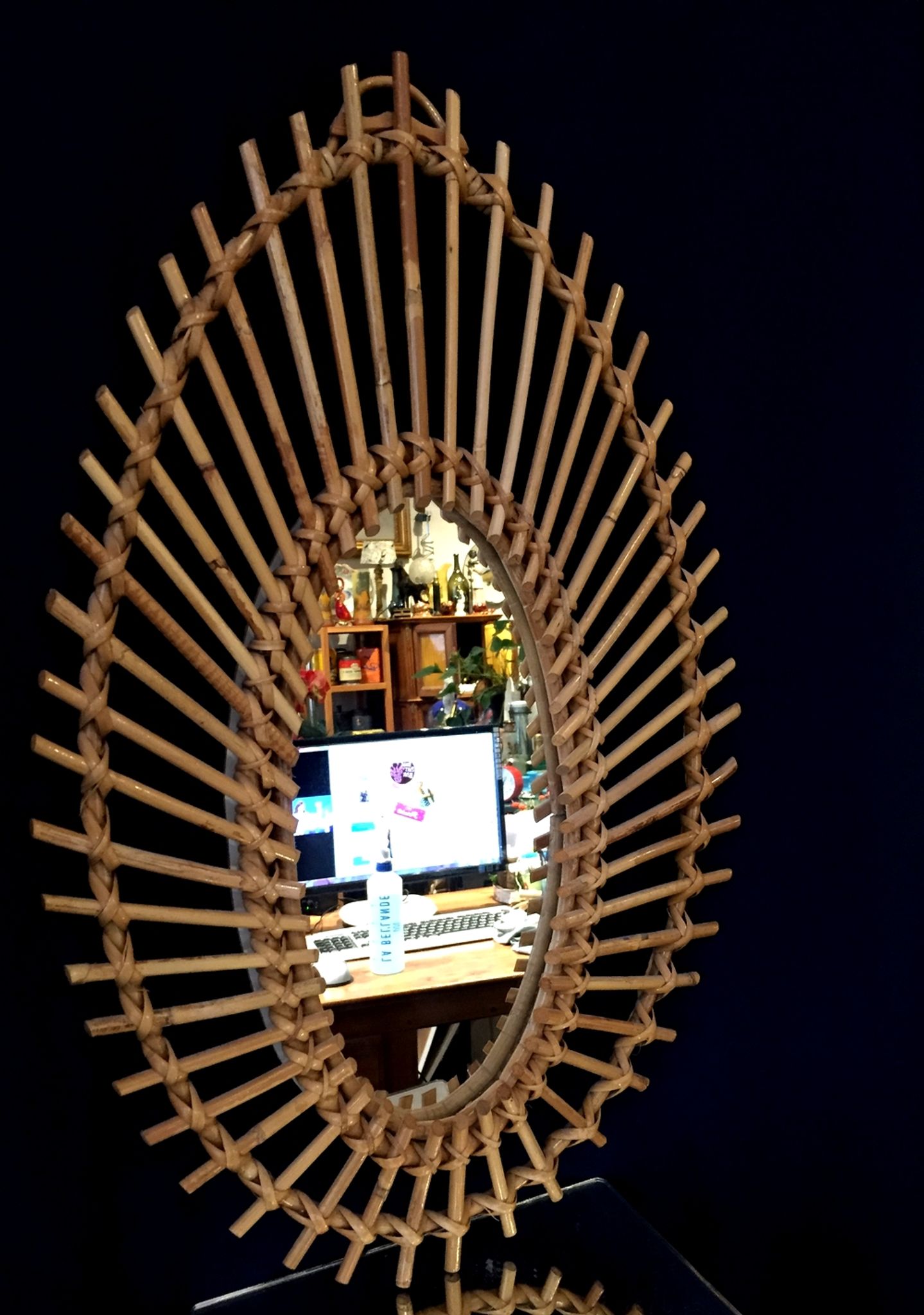 Oval shaped sun mirror in vintage rattan 1960/1970