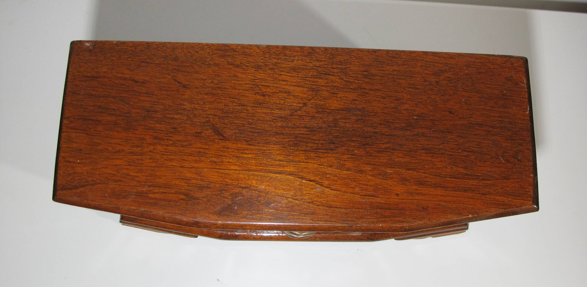Wooden jewelry box in the shape of a dresser