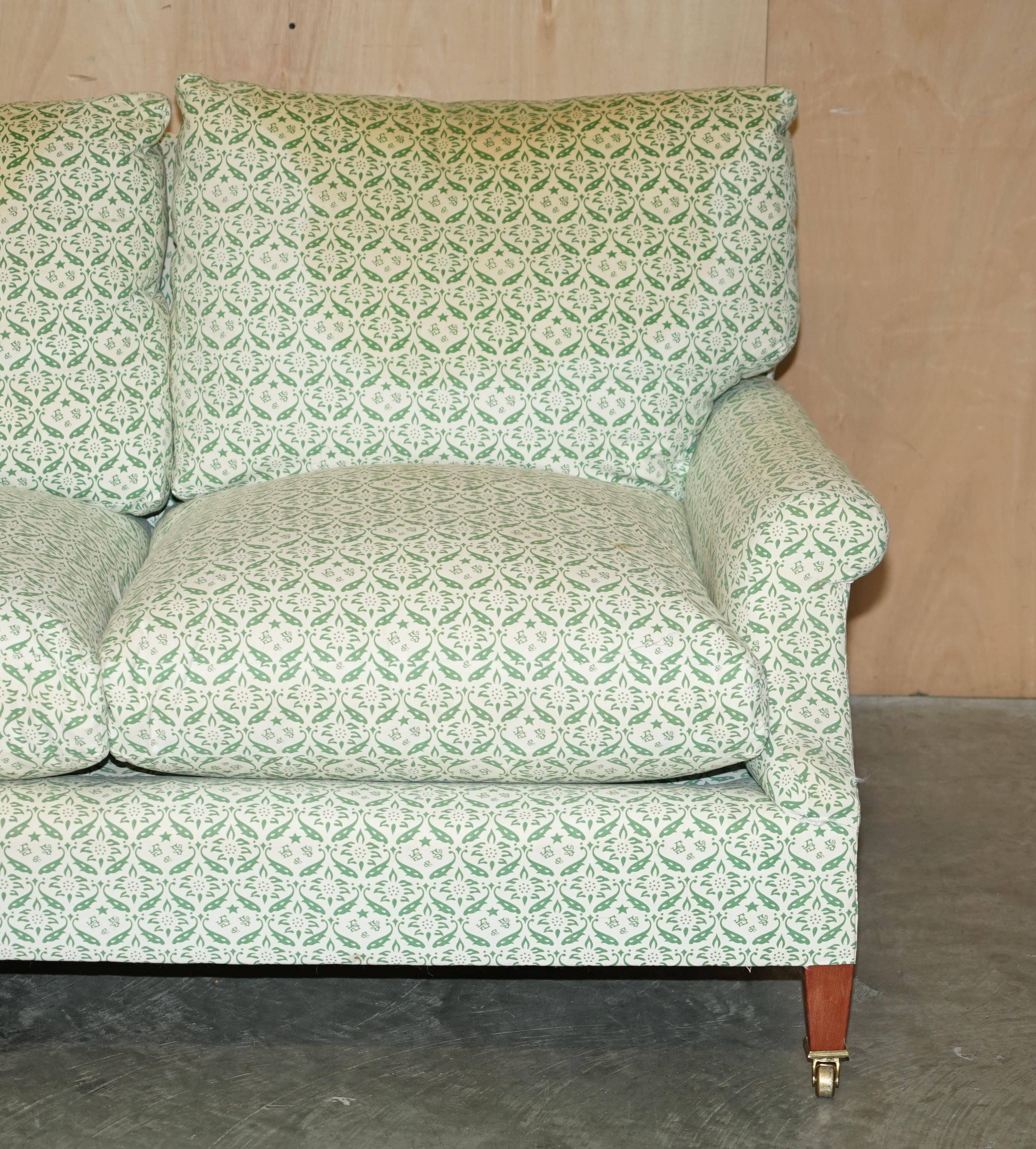 Howard & Son's Chairs Ltd ticking fabric canapé with feather cushions.