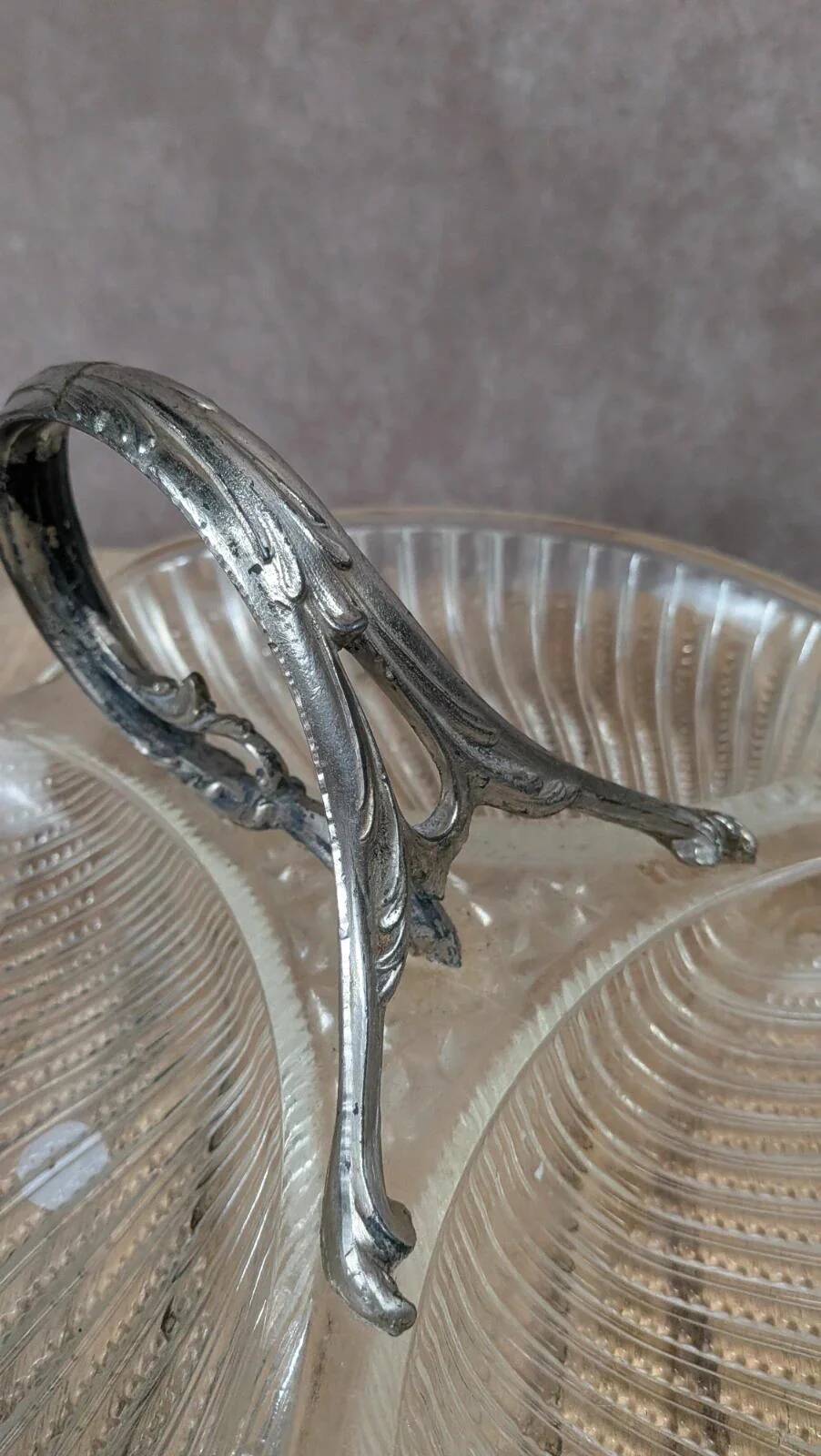 Vintage glass serving tray with silver-plated handle.