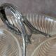 Vintage glass serving tray with silver-plated handle.