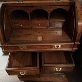 Antique solid wood secretary with a drop-down cylinder compartment.