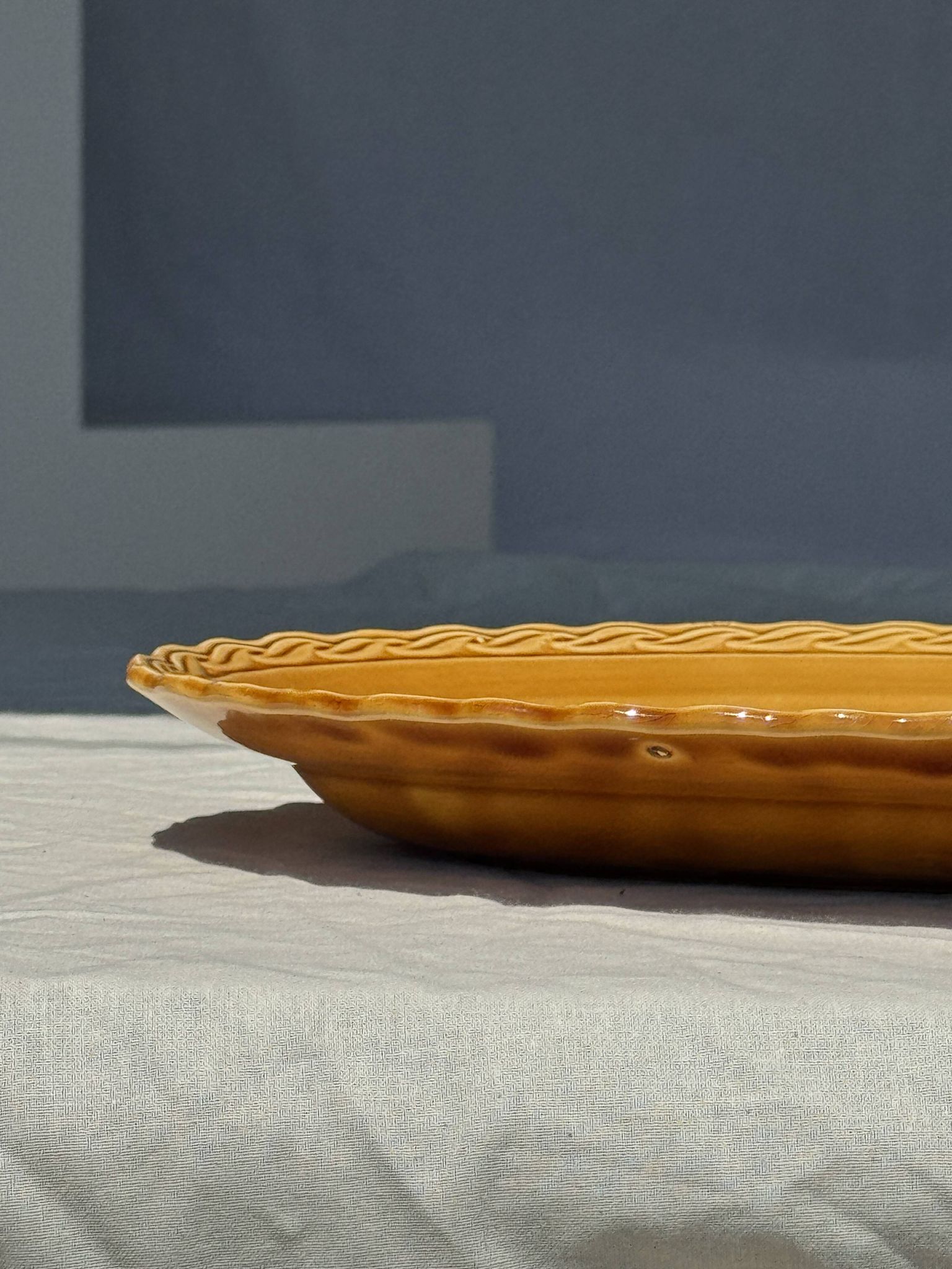 Antique oval dish, yellow-orange, frieze border L:24