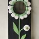 Ceramic flower mirror.