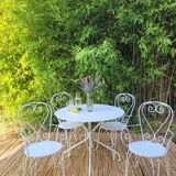 Renovated round table and garden armchairs