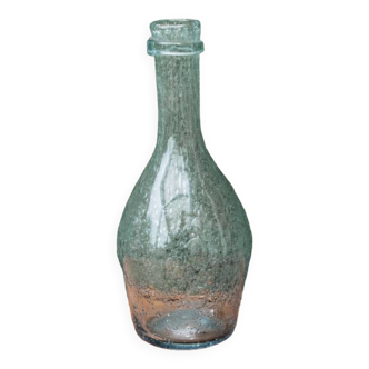 Biot blown glass bottle