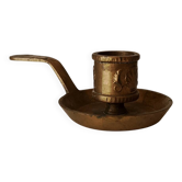 Antique hand-held candlestick in gilded bronze