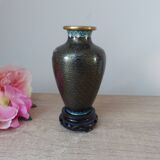 Small black cloisonné vase decorated with yellow and pink cherry blossoms, vase on wooden base