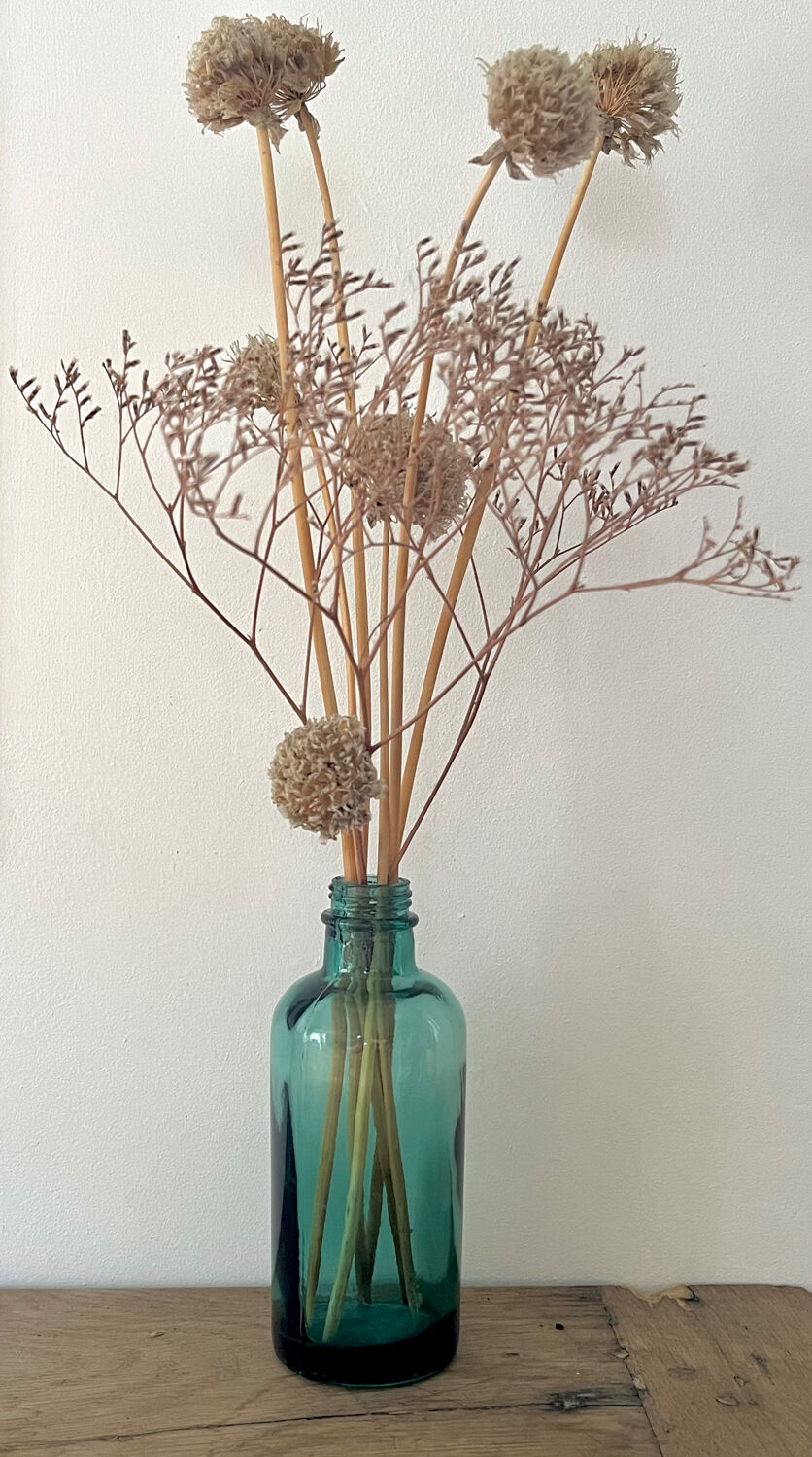 Small vintage dark turquoise blue bottle