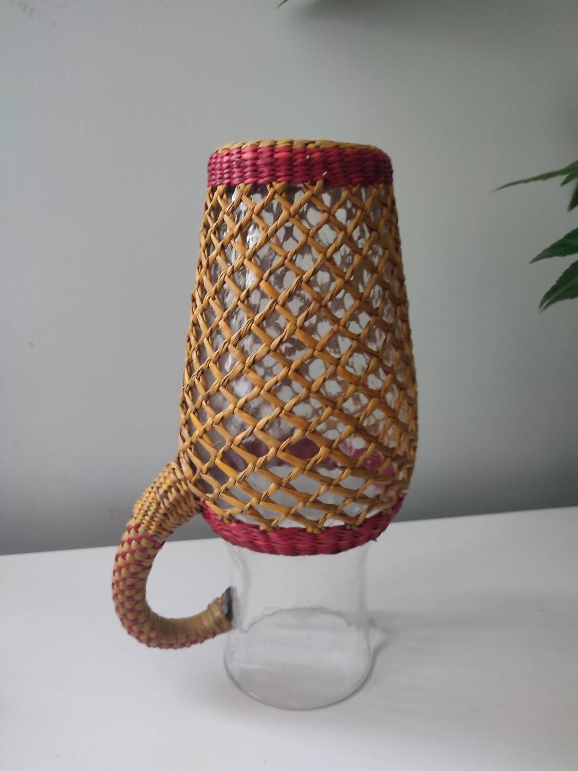 Glass and raffia water carafe