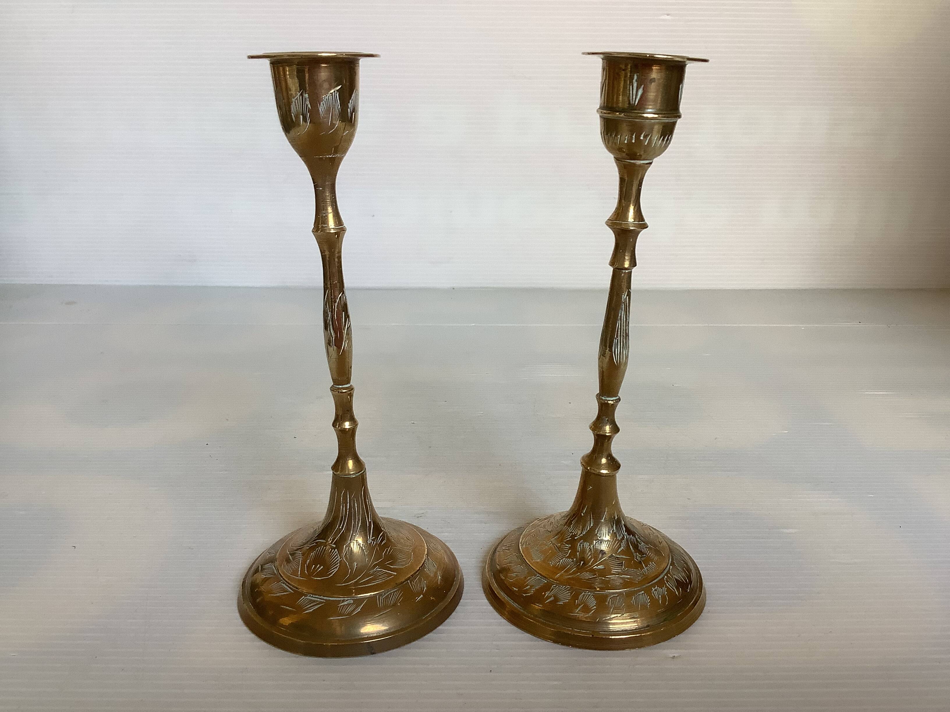 Pair of worked brass candlesticks