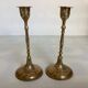 Pair of worked brass candlesticks
